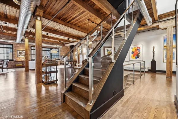 a view of a chairs and table in patio