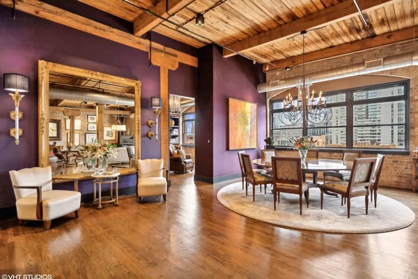a view of a dining room with furniture window and wooden floor