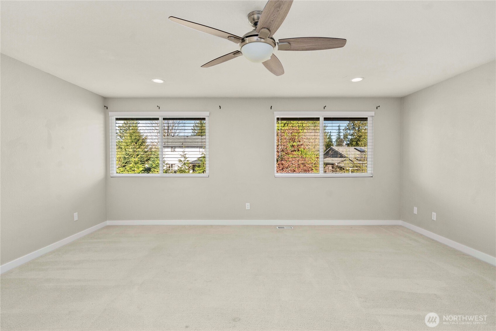 21816 Southeast 269th Street Maple Valley, WA 98038 - Photo 16 of 35 an empty room with windows and fan