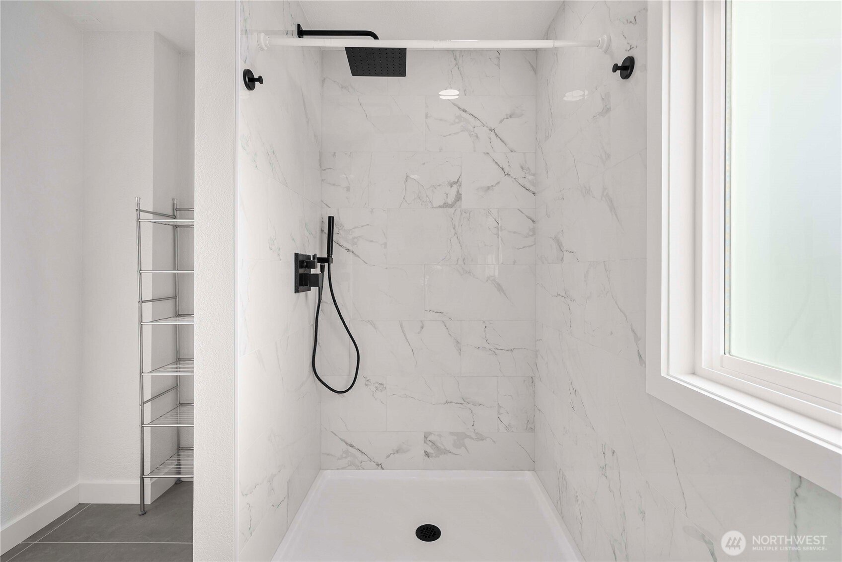 21816 Southeast 269th Street Maple Valley, WA 98038 - Photo 21 of 35 a bathroom with a glass shower door