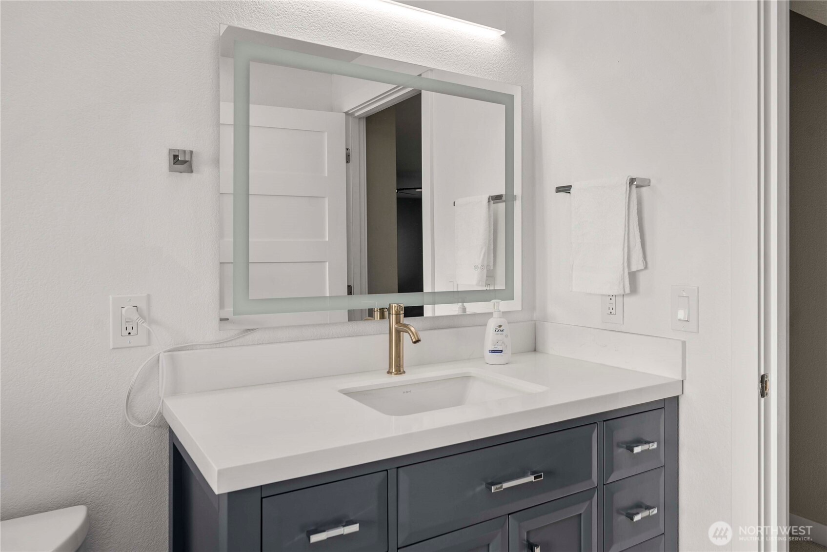 21816 Southeast 269th Street Maple Valley, WA 98038 - Photo 22 of 35 a bathroom with a sink and a mirror