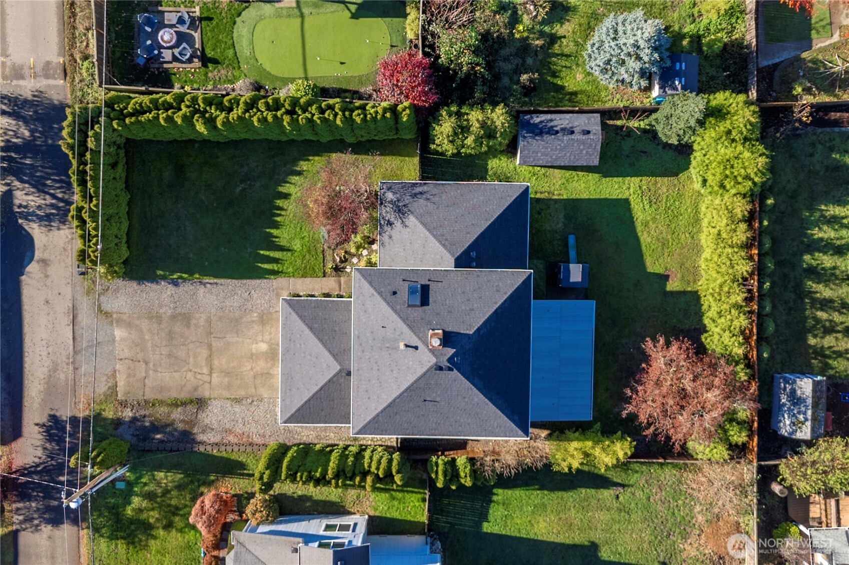 21816 Southeast 269th Street Maple Valley, WA 98038 - Photo 30 of 35 an aerial view of a house with a yard and a large tree