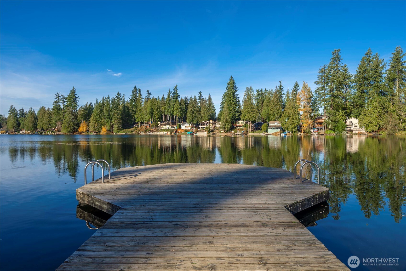 21816 Southeast 269th Street Maple Valley, WA 98038 - Photo 33 of 35 a view of a lake with houses in the back