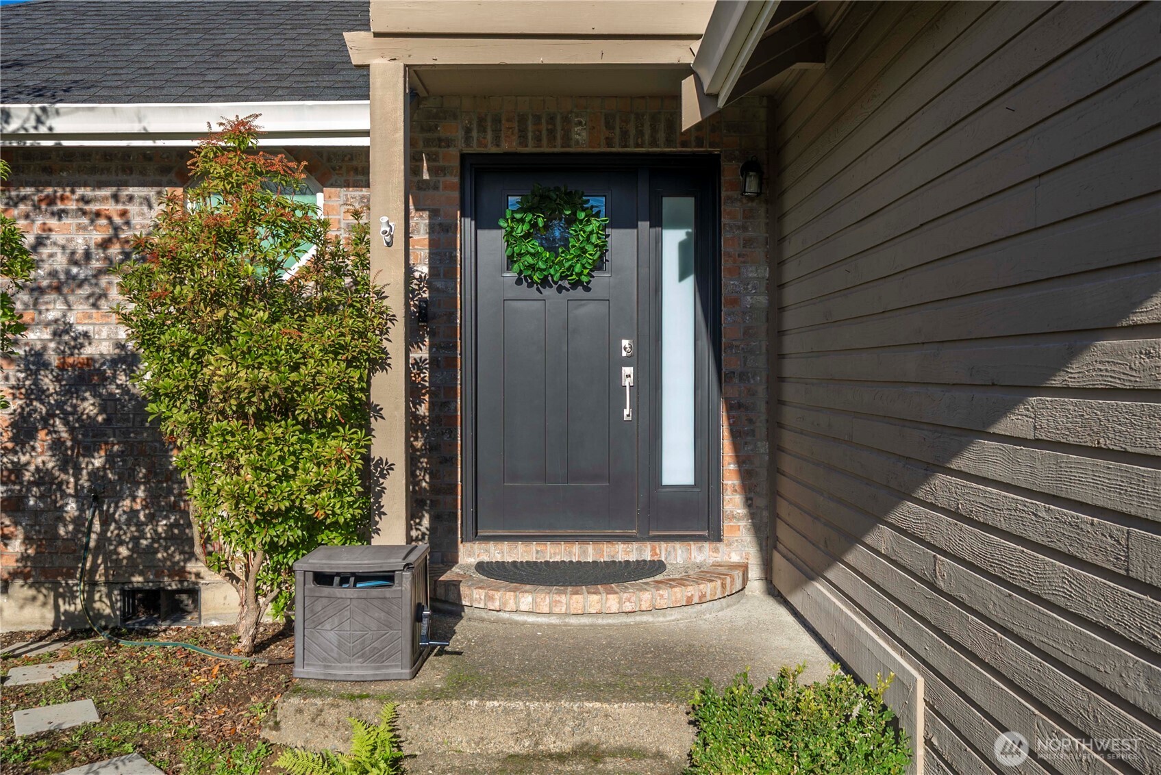 21816 Southeast 269th Street Maple Valley, WA 98038 - Photo 4 of 35 a view of a door of the house and outdoor space