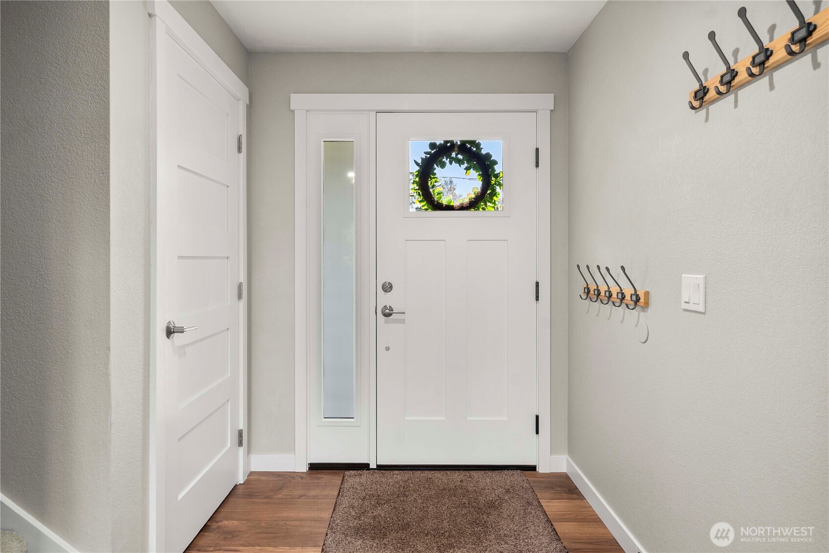 21816 Southeast 269th Street Maple Valley, WA 98038 - Photo 5 of 35 a view of hallway with wooden floor