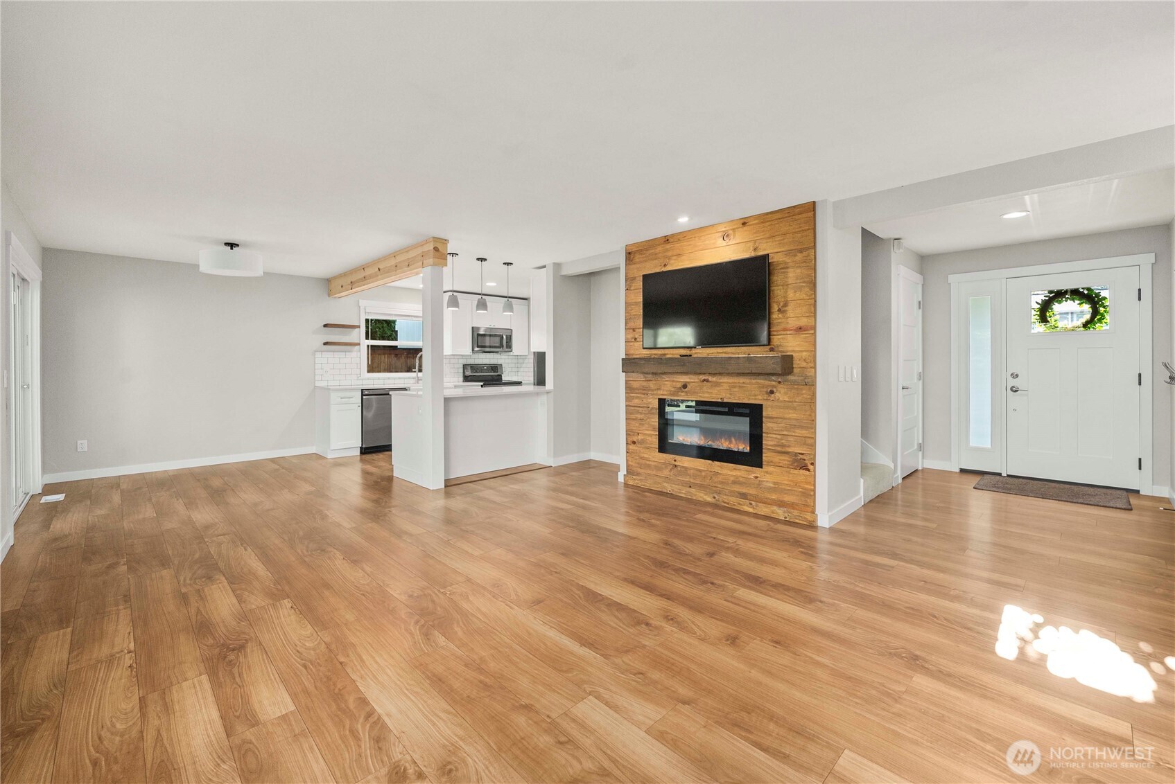 21816 Southeast 269th Street Maple Valley, WA 98038 - Photo 6 of 35 a view of a livingroom with furniture and a flat screen tv