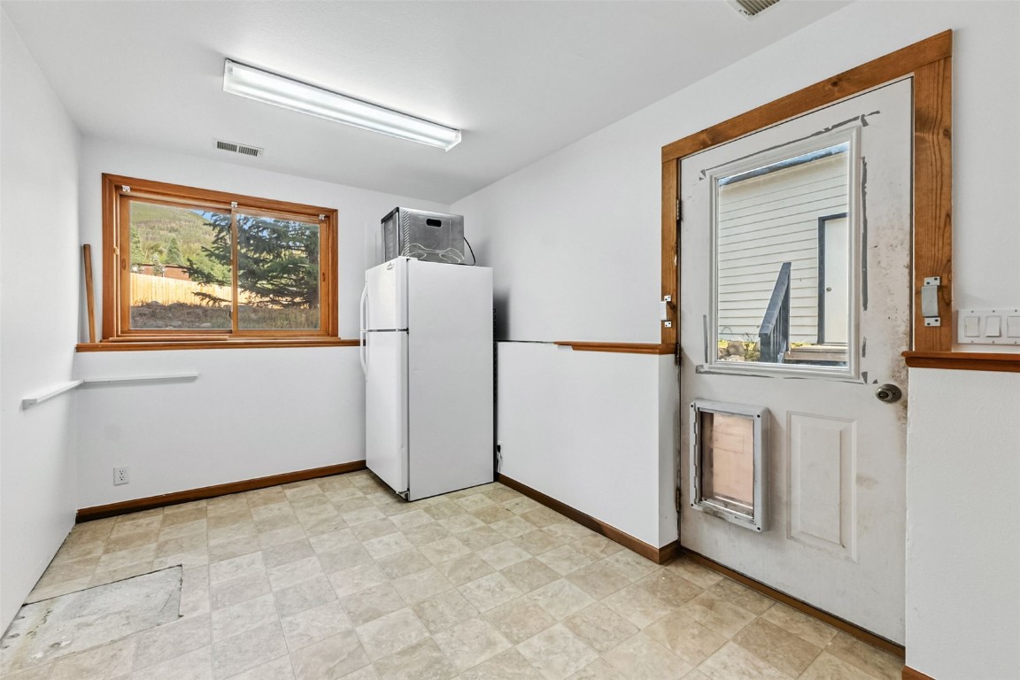 114 Big Elk Road Dillon, CO 80435 - Photo 41 of 50 a view of a room with a refrigerator and dresser
