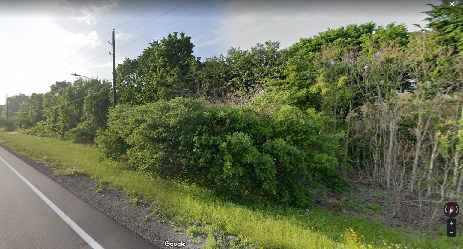 0 Hwy 290 Bus Rd Prairie View Prairie View, TX 77484 - Photo 1 of 7 a view of a garden with a tree