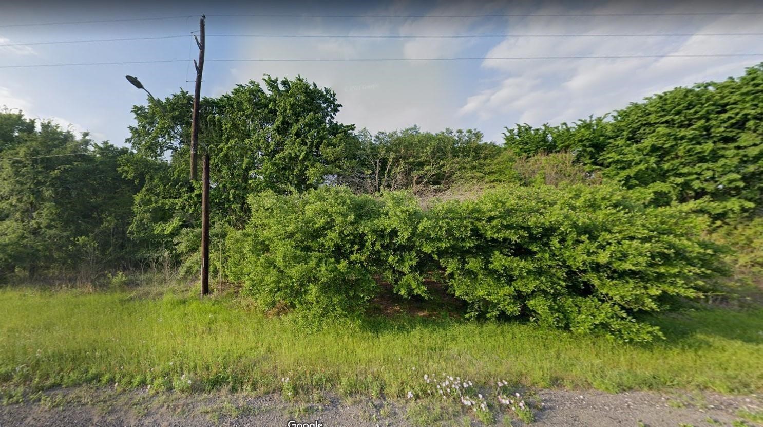 0 Hwy 290 Bus Rd Prairie View Prairie View, TX 77484 - Photo 2 of 7 a backyard of a house with lots of green space
