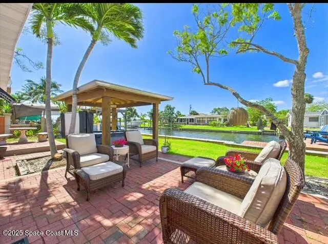 a view of a two chairs in a patio