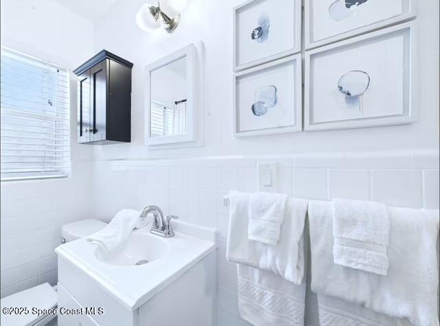 1747 Wavecrest Street Merritt Island, FL 32952 - Photo 17 of 21 a bathroom with a sink and a mirror