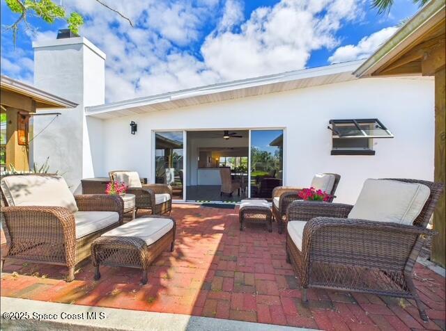 1747 Wavecrest Street Merritt Island, FL 32952 - Photo 19 of 21 a living room with furniture and a flat screen tv