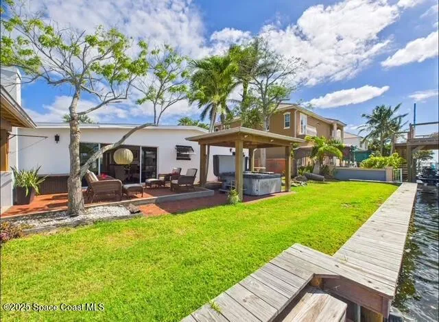 a view of a house with a yard porch and sitting area