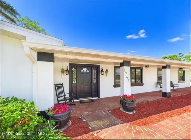 1747 Wavecrest Street Merritt Island, FL 32952 - Photo 2 of 21 a front view of a house with porch