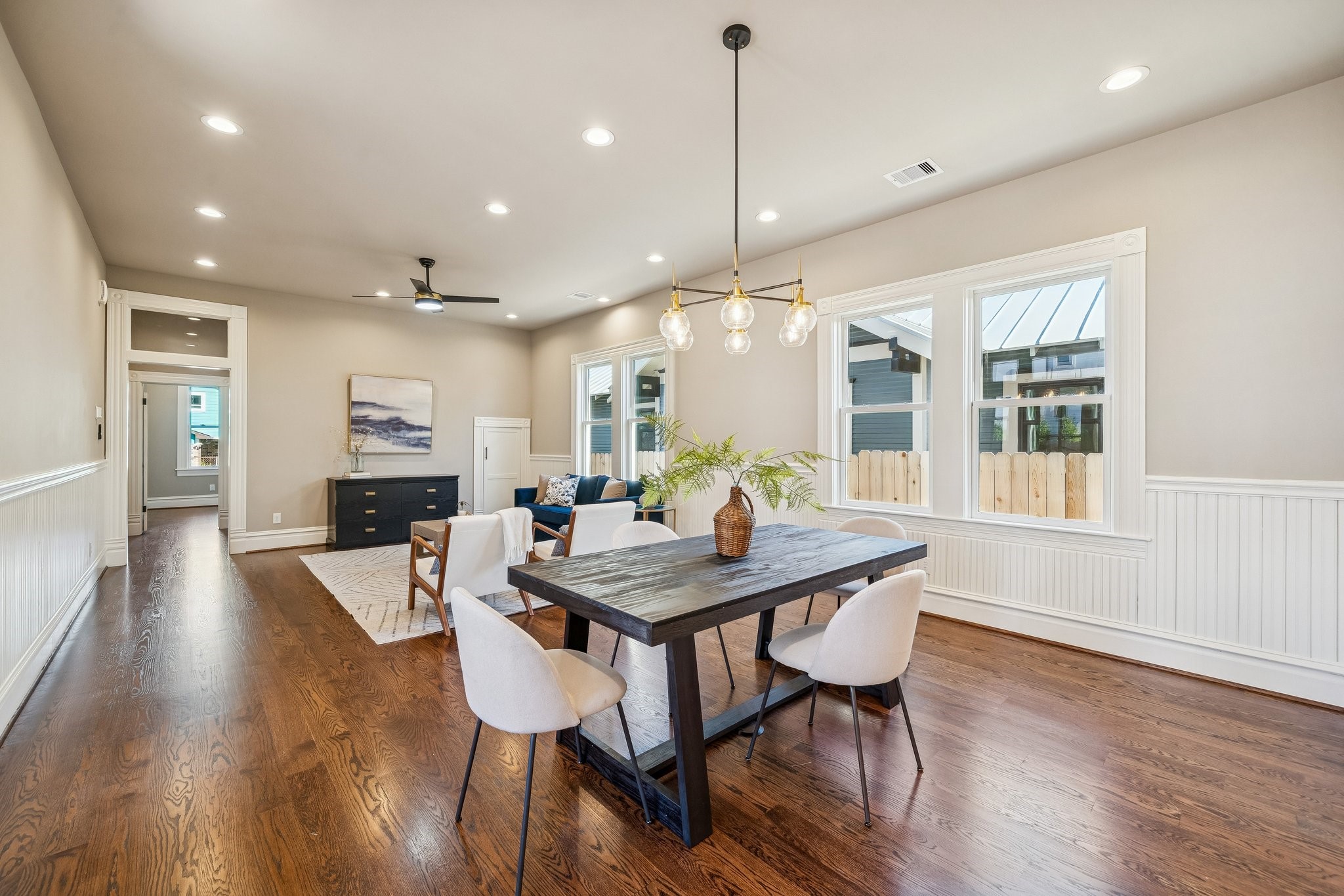 1521 Ovid Street Houston, TX 77007 - Photo 13 of 44 Standing in the dining space, looking towards the Living area / front of the home. Note the TALL CEILINGS. Door on far right is STORAGE space under the stairs!