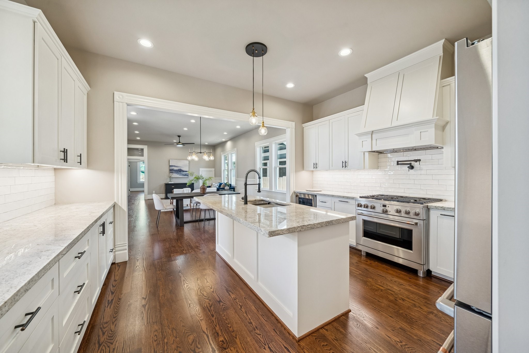 1521 Ovid Street Houston, TX 77007 - Photo 15 of 44 Island seating for up to 4. Stainless steel appliances throughout. Pot filler above the 36" gas range / electric oven!