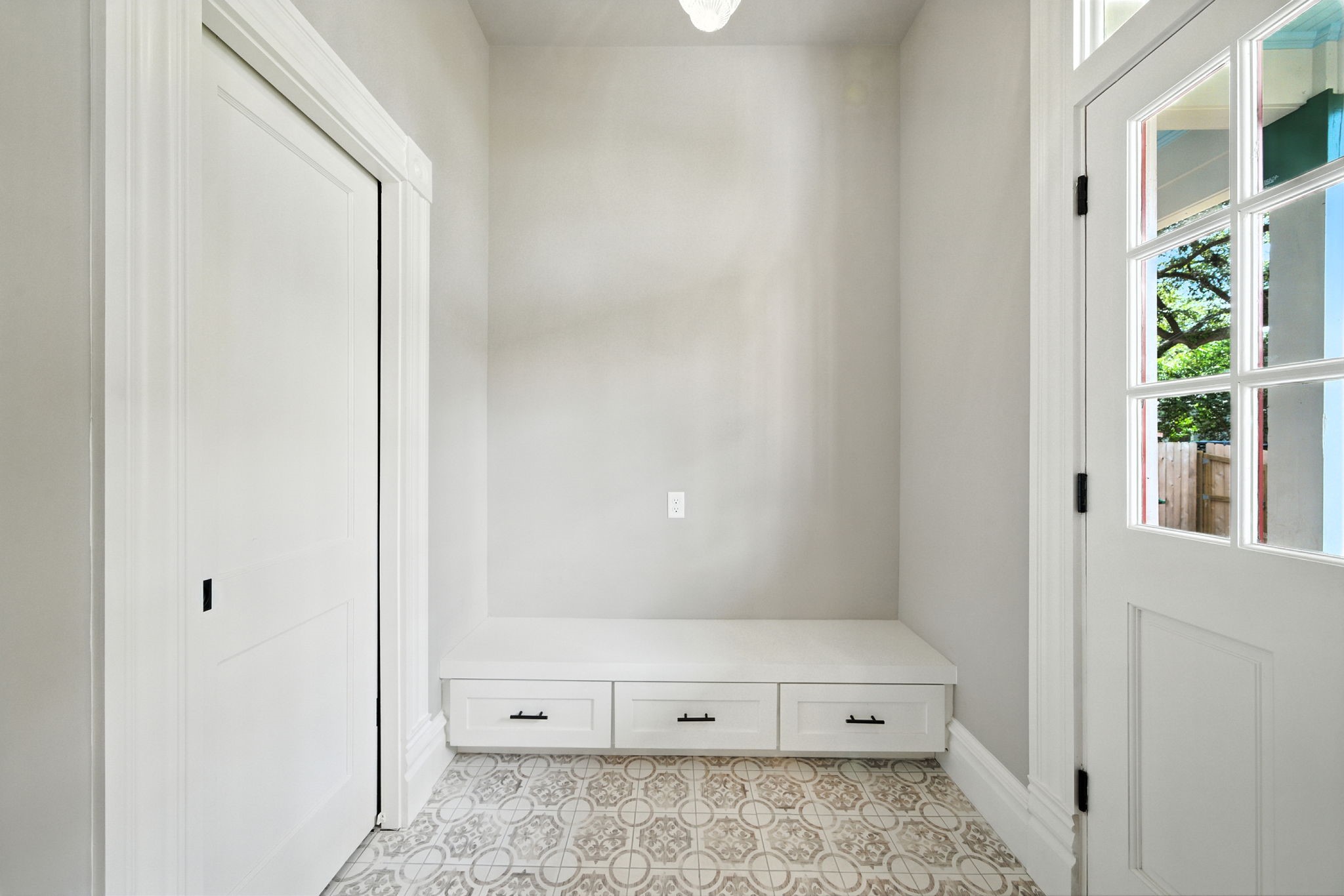 1521 Ovid Street Houston, TX 77007 - Photo 18 of 44 Just a quick peek into the mudroom. Door (closed) on the left is the half bath. Rear entry door on the right, making it easy to enter/exit to the carport / backyard