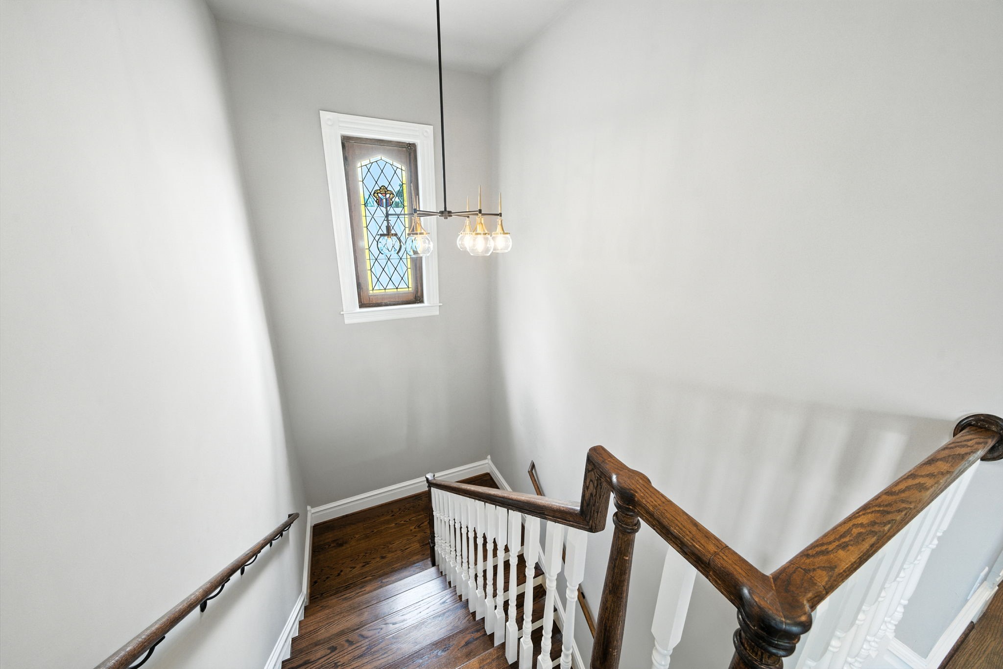 1521 Ovid Street Houston, TX 77007 - Photo 23 of 44 Up we go to the 2nd floor!! Beautiful stained glass window that provides so much natural light and makes such an impact in this area!