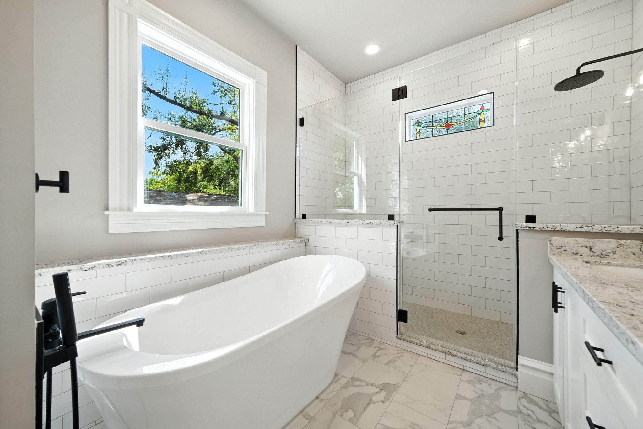 1521 Ovid Street Houston, TX 77007 - Photo 28 of 44 Note the window above the tub for natural light and stained glass window in the shower!