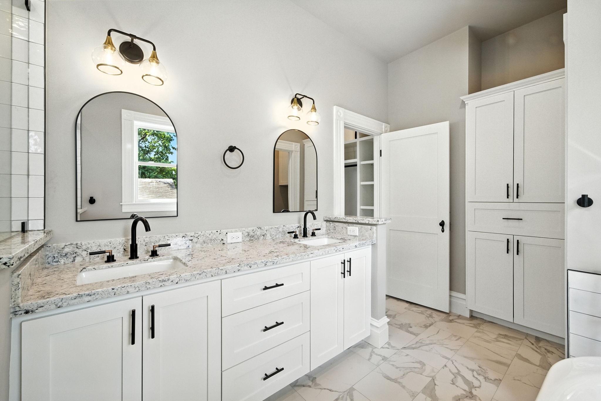 1521 Ovid Street Houston, TX 77007 - Photo 29 of 44 Double sinks and lots of storage including linen closet on the right