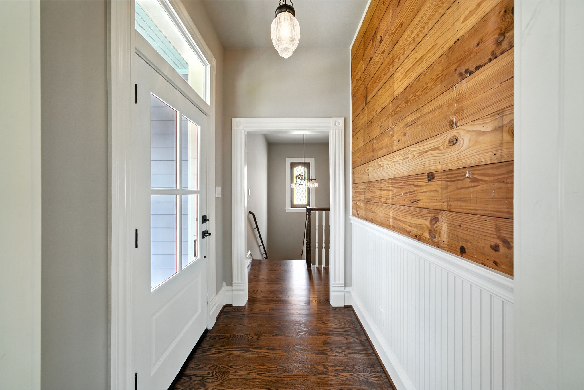 1521 Ovid Street Houston, TX 77007 - Photo 38 of 44 Hallway with wainscoting and reclaimed shiplap features beautifully here! Door exits onto the second floor porch!