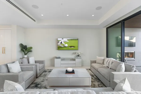 a balcony with furniture and a potted plant