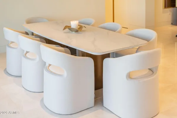 a bathroom with a sink and a refrigerator