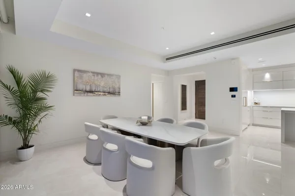 a white bath tub sitting next to a white sink