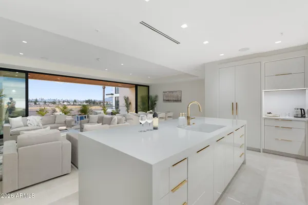 a bathroom with 2 sink and a mirror