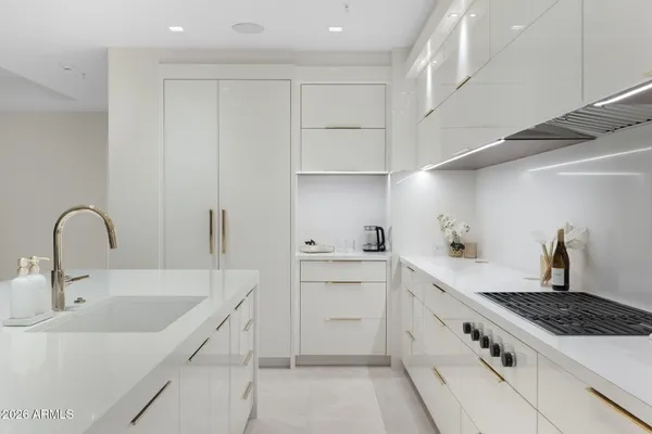 a bedroom with a bed and a potted plant