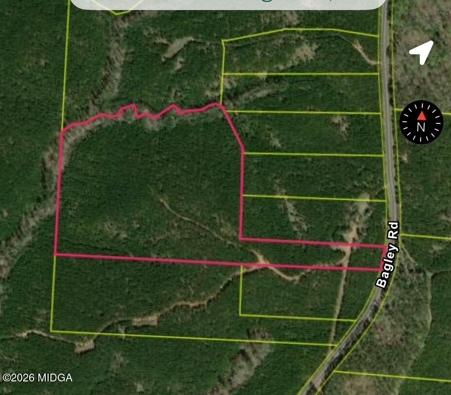 457 Bagley Road Forsyth, GA 31029 - Photo 1 of 7 a view of a room with gym equipment