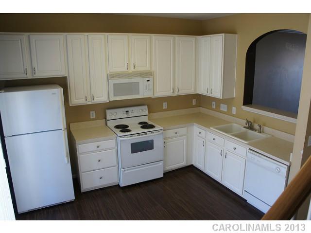 710 Shellstone Place, Unit 710 Fort Mill, SC 29708 - Photo 5 of 14 a kitchen with cabinets appliances and a sink