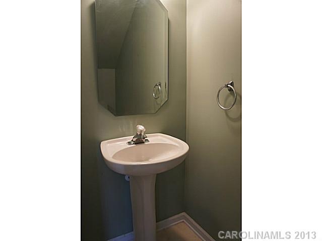 710 Shellstone Place, Unit 710 Fort Mill, SC 29708 - Photo 7 of 14 a bathroom with a sink a mirror and a toilet