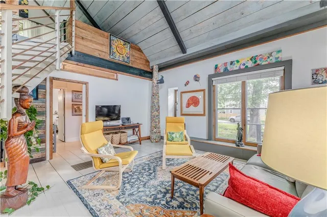 a bedroom with a bed and the view of bathroom