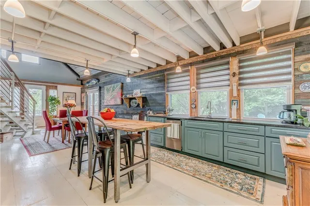 a view of a kitchen with furniture and window