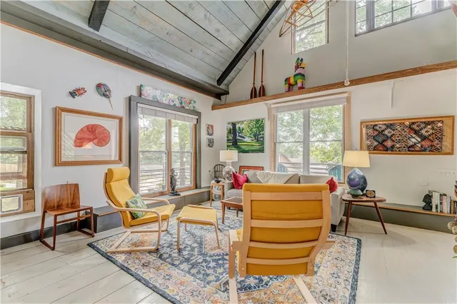 a view of a living room filled with furniture