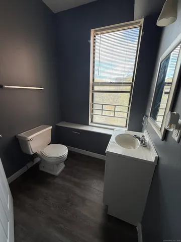 a bathroom with a sink a toilet and tub
