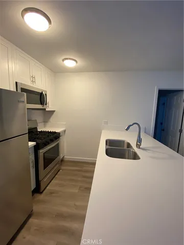 a bathroom with a double vanity sink and mirror
