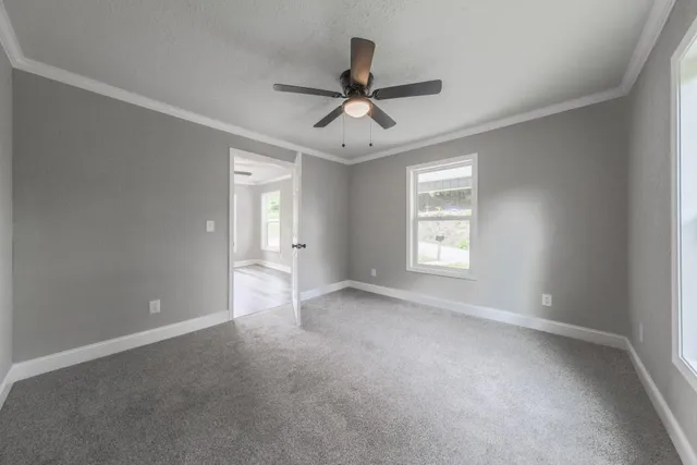 a view of an empty room with a window