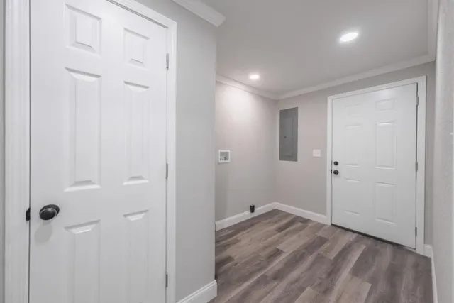 a view of a room with wooden floor