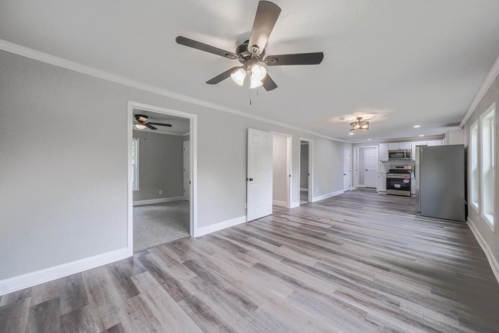 11 Cloverhurst Drive Toccoa, GA 30577 - Photo 5 of 26 a view of empty room with wooden floor and ceiling fan