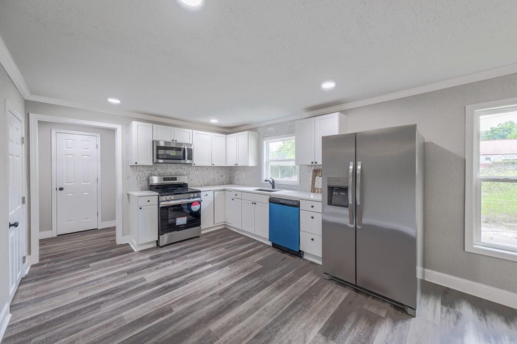 11 Cloverhurst Drive Toccoa, GA 30577 - Photo 9 of 26 a kitchen with stainless steel appliances a refrigerator sink and cabinets