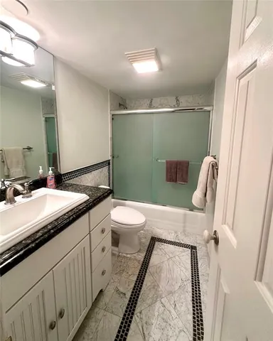 a bathroom with a double vanity sink and mirror