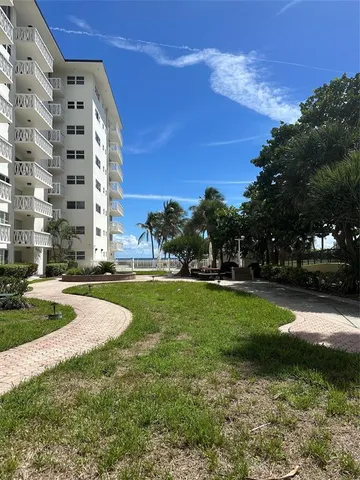 a view of a patio with a table and chairs