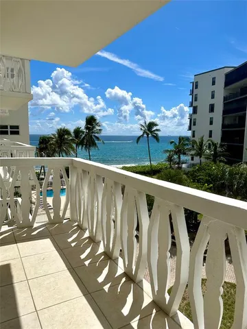 a view of balcony with furniture