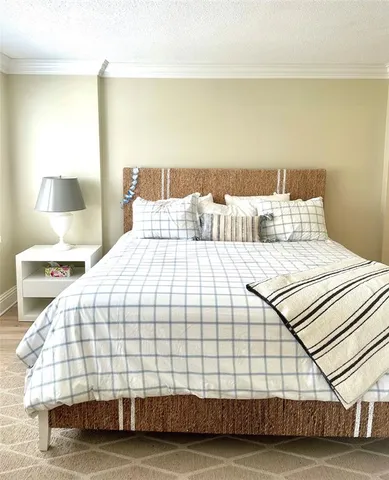 a bedroom with a bed and a night stand