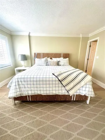 a bedroom with a bed and a mirror