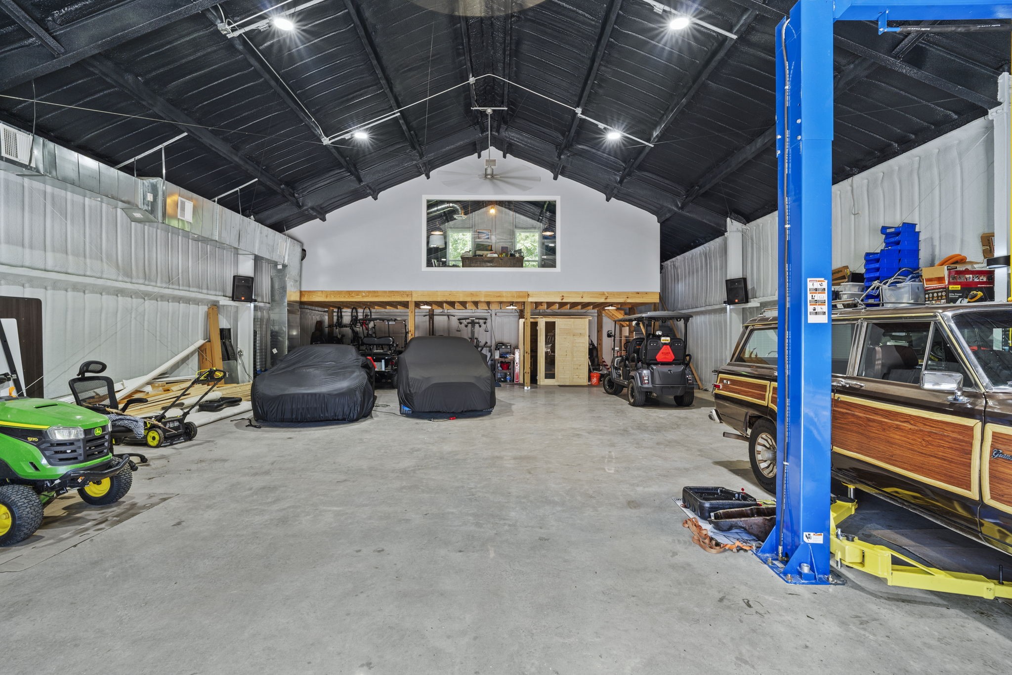 7100 Sycamore Grove Road Montgomery, TX 77316 - Photo 42 of 45 Fully air conditioned 40x60 shop with car lift and 500 ft mezzanine