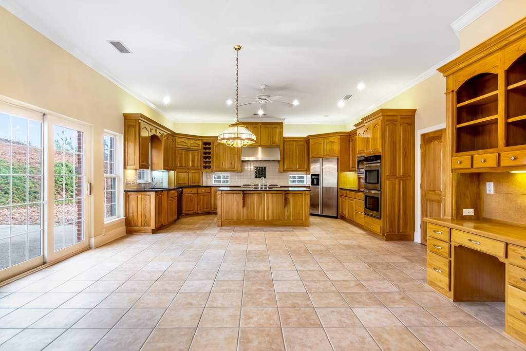 8010 Scudder Way Ball Ground, GA 30107 - Photo 12 of 57 a view of kitchen with furniture and large window