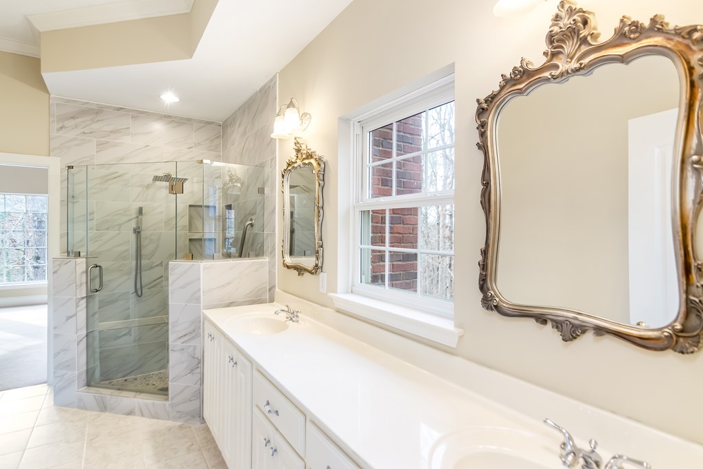 8010 Scudder Way Ball Ground, GA 30107 - Photo 17 of 57 a bathroom with a tub sink and shower